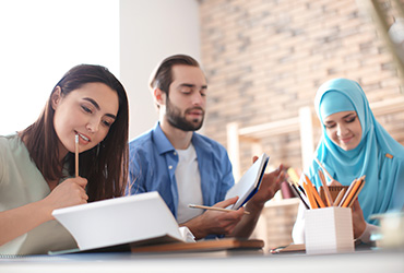 Three colleagues in a meeting.